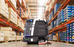 Avidbots autonomous floor scrubber in middle of warehouse aisle