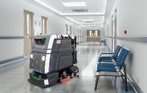 Autonomous floor scrubber cleaning hospital hallway