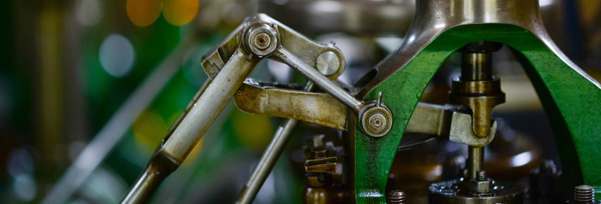 closeup of green metal manufacturing equipment