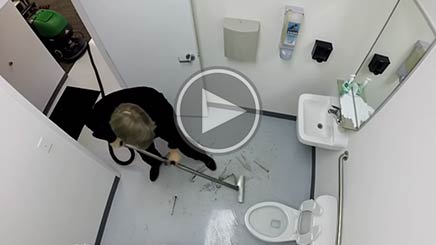 Cleaning bathroom with vacuum wand