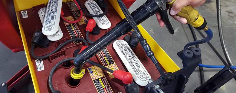Watering Trojan Batteries on a floor cleaning machine